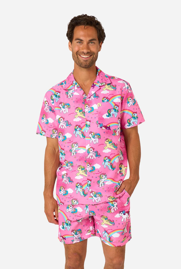 Man wearing pink summer set with My Little Pony and rainbow pattern on a light background.