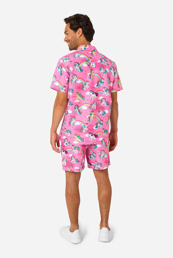 Man wearing pink summer set with My Little Pony and rainbow pattern on a light background.View from the back.