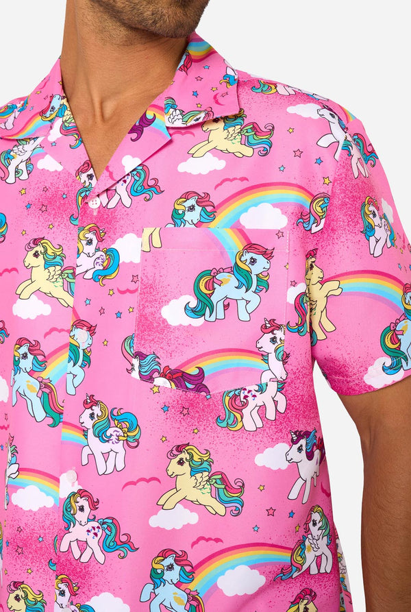 Man wearing pink summer set with My Little Pony and rainbow pattern on a light background. Chest view.