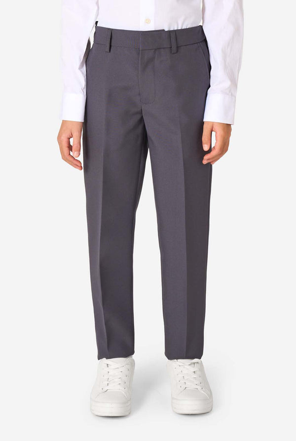 Kid wearing a stylish charcoal colored grey suit with a white dress shirt, smiling confidently. Perfect formal outfit for boys' special occasions, weddings, and parties. Pants close-up.