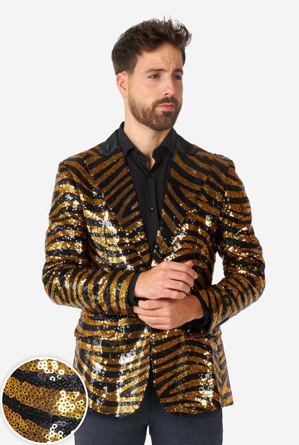 Man wearing a gold and black sequin jacket on a white background