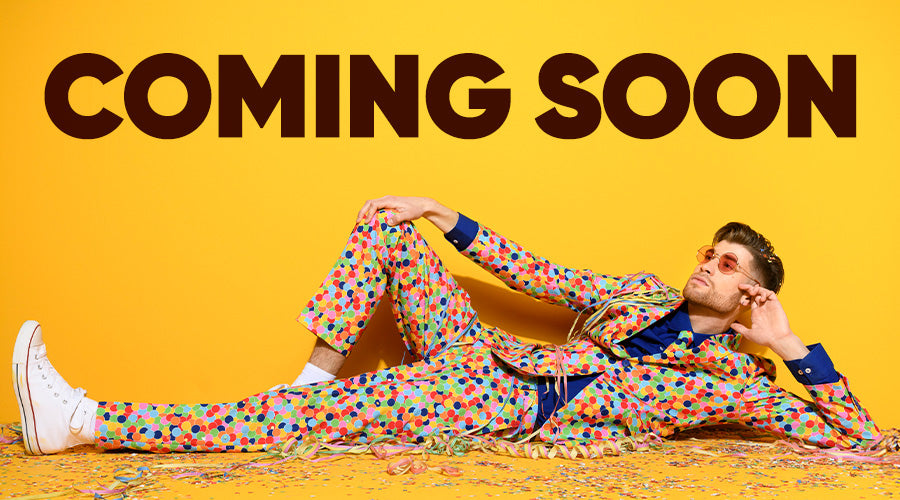 Image with yellow background and a man laying on the floor wearing a confetti suit, and the text Coming Soon on top.