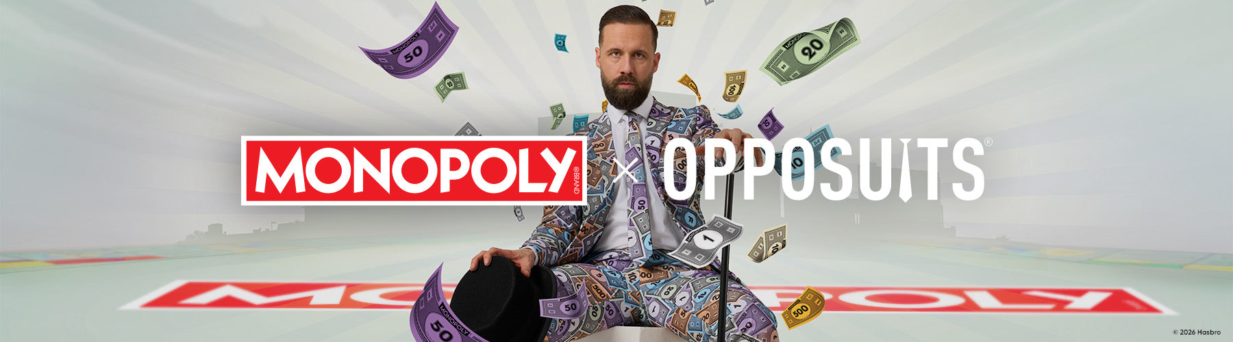 Image of a man wearing a monopoly money suit sitting on a Monopoly board. The logos of Monopoly and OppoSuits in the center.