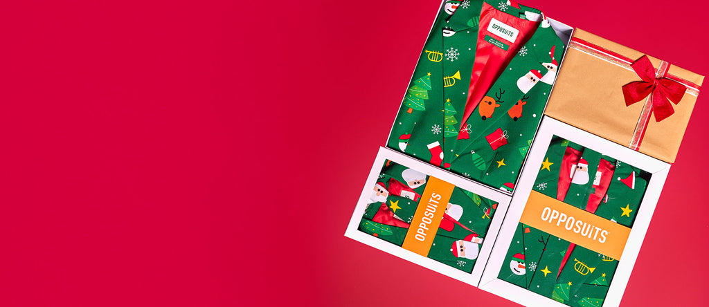 Image with red background and 4 OppoSuits retailboxes in a square. 1 Box packed as a present. 3 boxes with a festivity green suit.