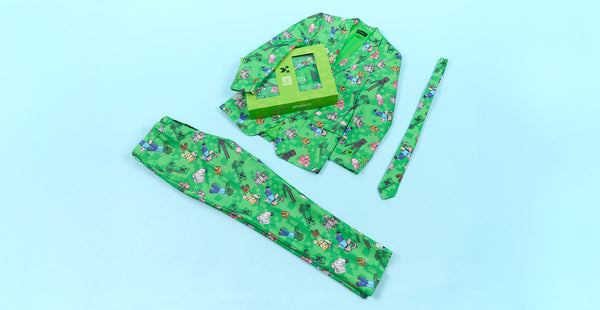 Green men's outfit with minecraft pattern on a light blue background. Blazer, pants and tie.