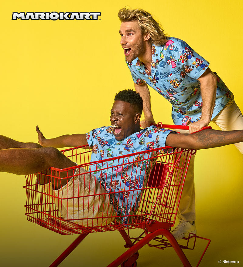 Image with yellow back ground and two men wearing blue Hawaiian with Mario Kart characters. One man in a shopping cart and the other pushing the cart.