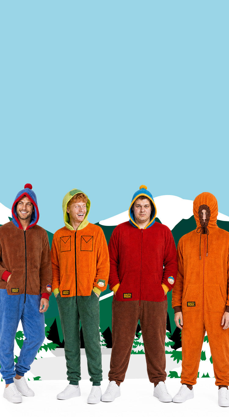 Four men wearing colorful South Park character onesies inspired by Stan, Kyle, Cartman, and Kenny, standing in front of a snowy South Park mountain backdrop.