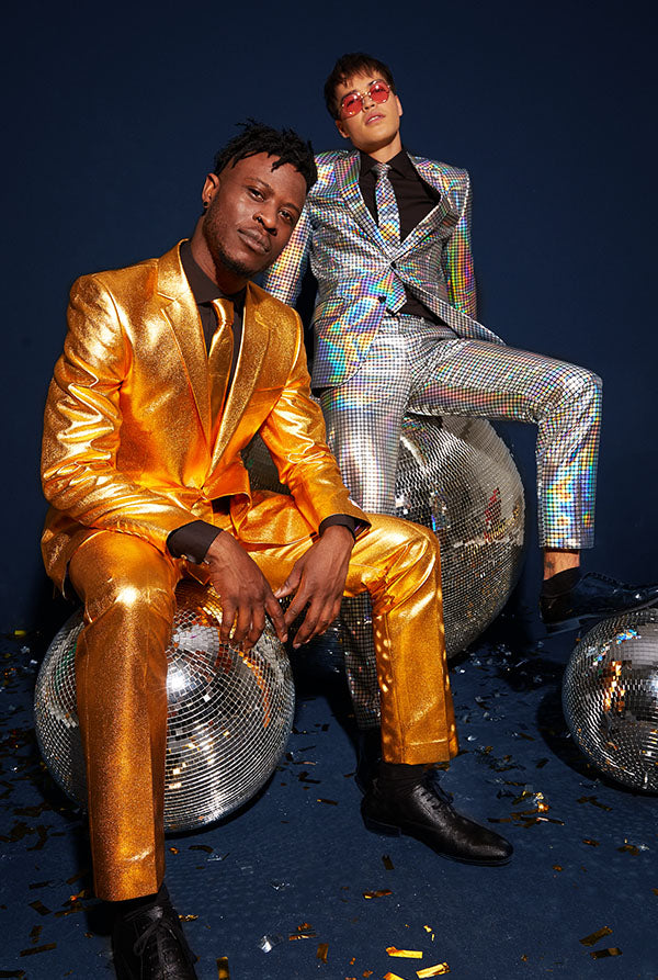 Image of two man siting on discobal and wearing a golden suit and a discobal suit.