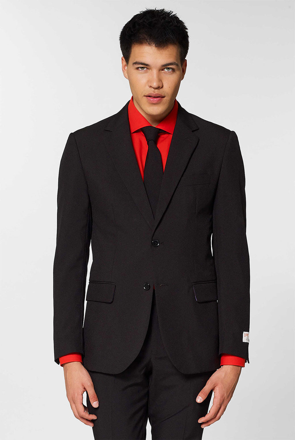 Video of man wearing OppoSuits Black Knight black men's suit. Suit consist of blazer, pants and tie.