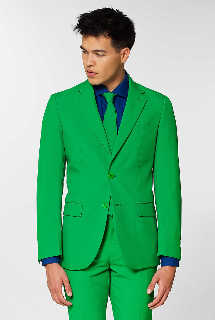 Video of man wearing Evergreen green men's suit, showing suit like a model. Suit consists of blazer, pant and tie.