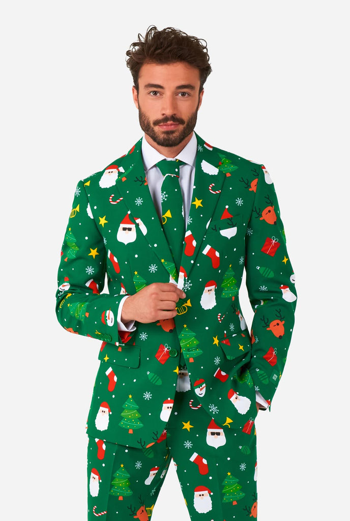 Video of man wearing Festivity Green men's Christmas suit, showing suit like a model. Suit consists of blazer, pant and tie.