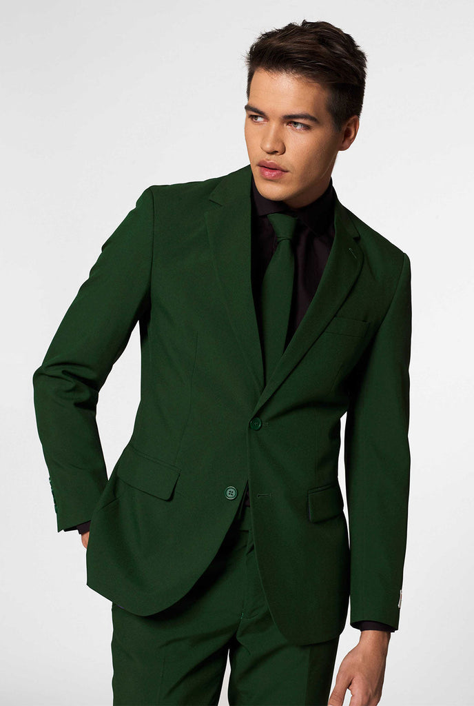 Video of man wearing Glorious Green, dark green men's suit, showing suit like a model. Suit consists of blazer, pant and tie.