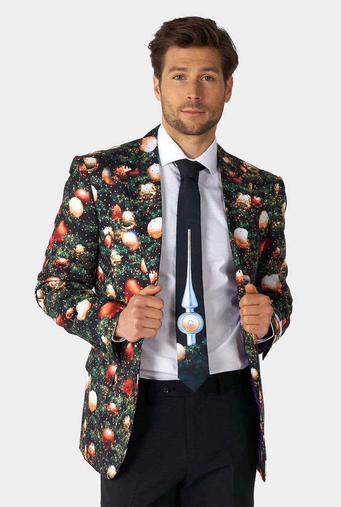 Video of man wearing Shine Pine men's Christmas suit, showing suit like a model. Suit consists of blazer, pant and tie.