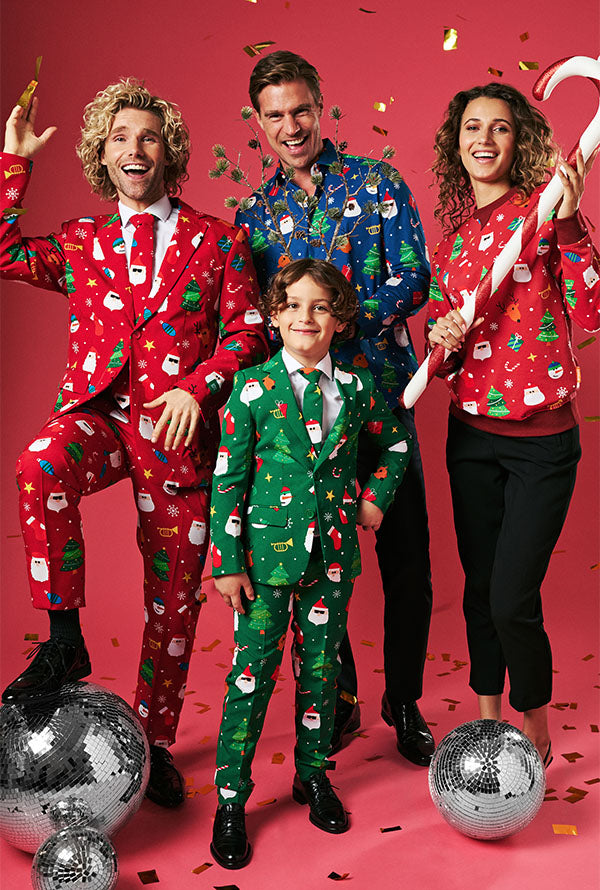 Image with red backgound and three adult and a kid wearing colorful Christmas Outfits. 