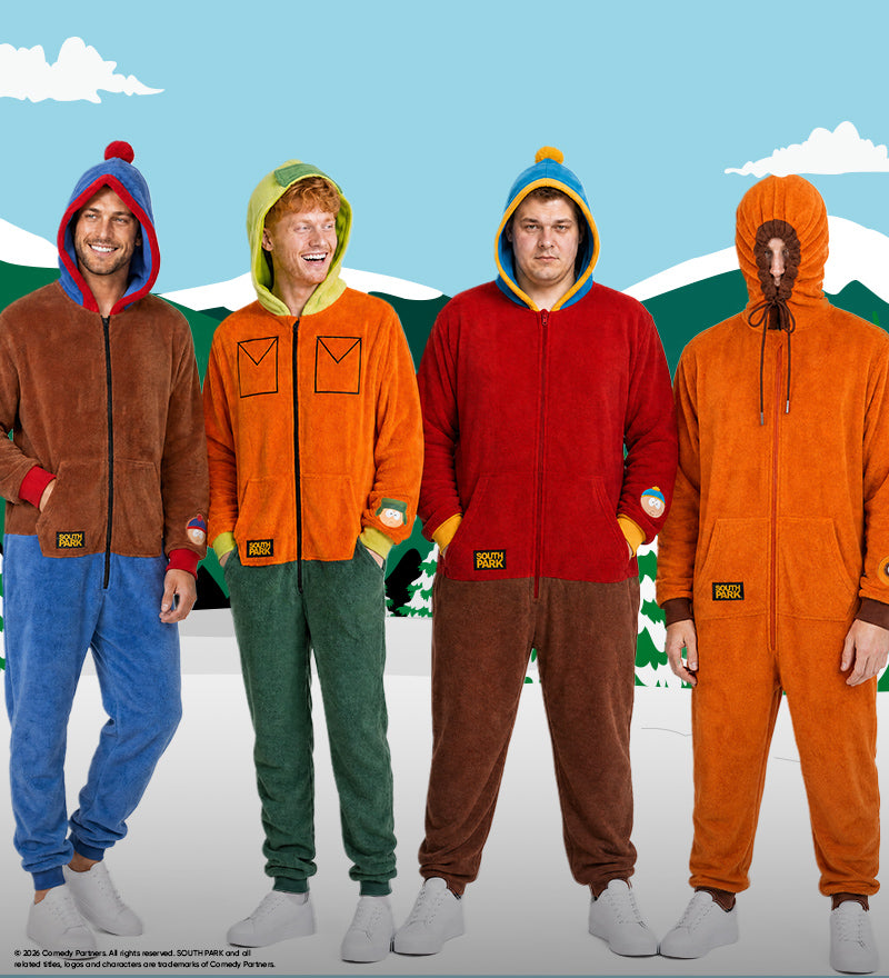Four men wearing colorful South Park character onesies inspired by Stan, Kyle, Cartman, and Kenny, standing in front of a snowy South Park mountain backdrop.