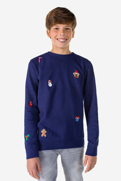 Kid wearing blue Christmas sweater with Christmas icons