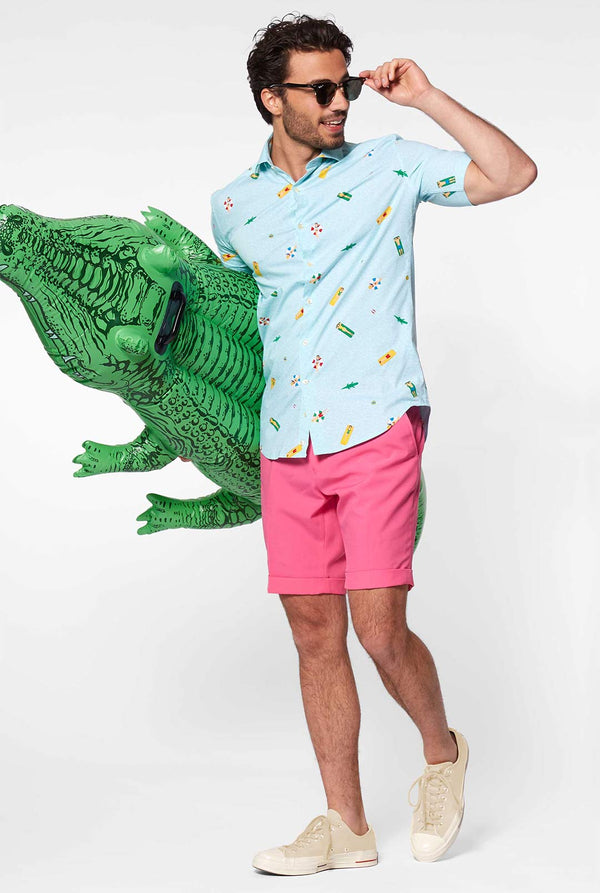 Man wearing light blue short sleeve shirt with pool icons