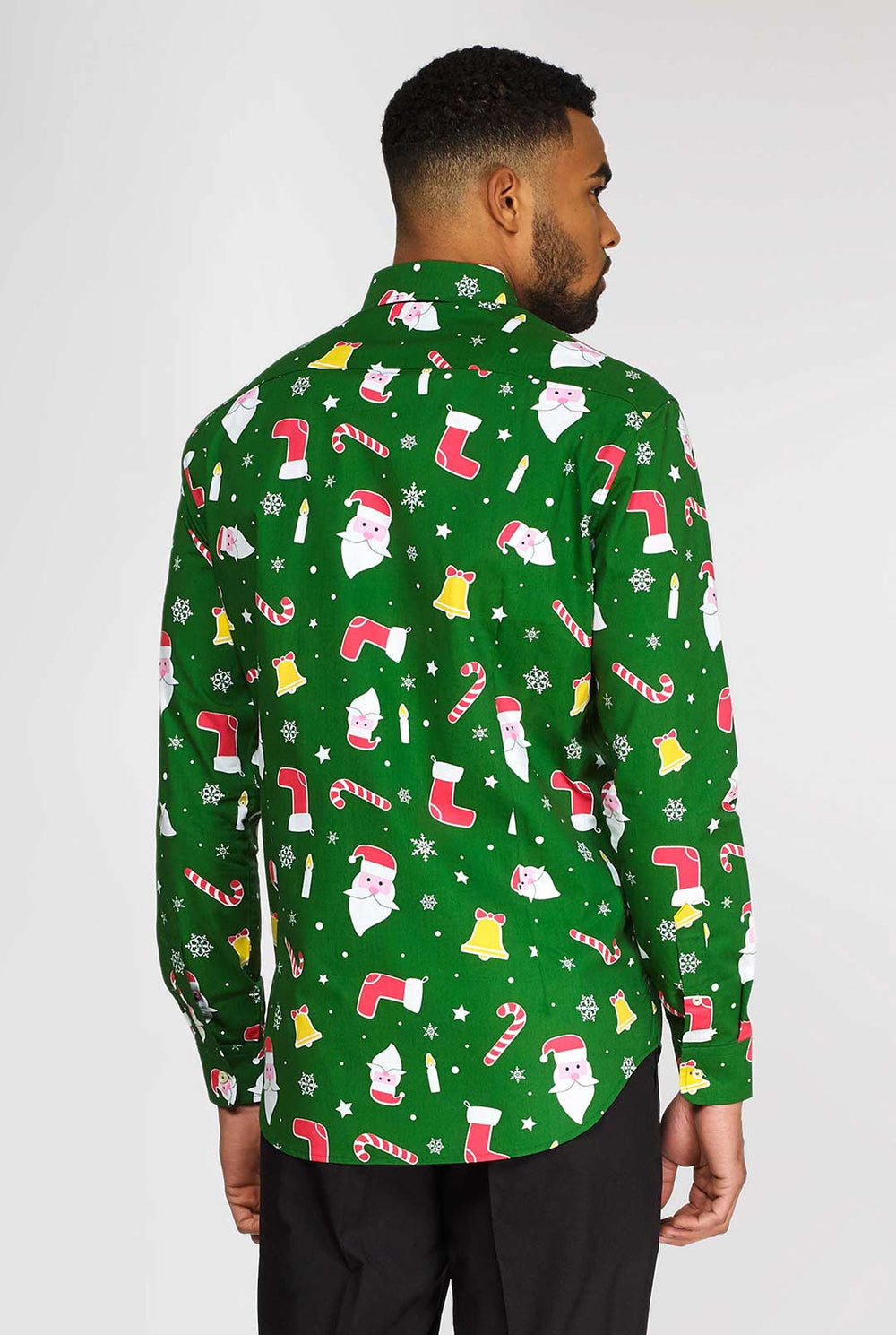 Man wearing green Christmas dress shirt with colored Christmas icons