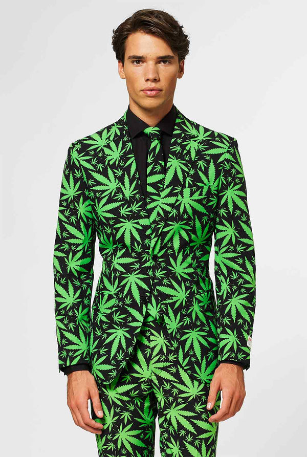 Man wearing black men's suit with green cannabis print