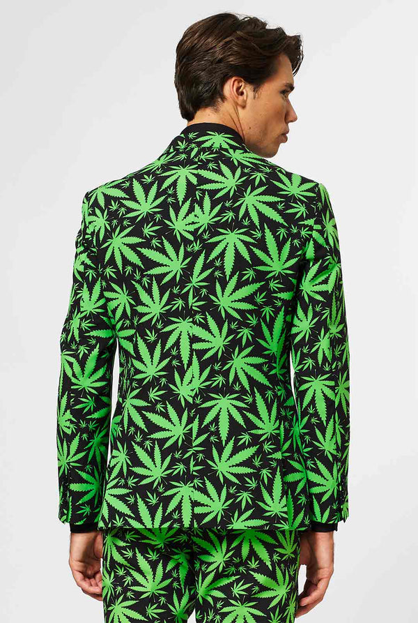 Man wearing black men's suit with green cannabis print