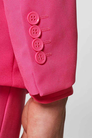 Man wearing pink men's suit with pink dress shirt