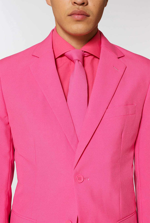 Man wearing pink men's suit with pink dress shirt