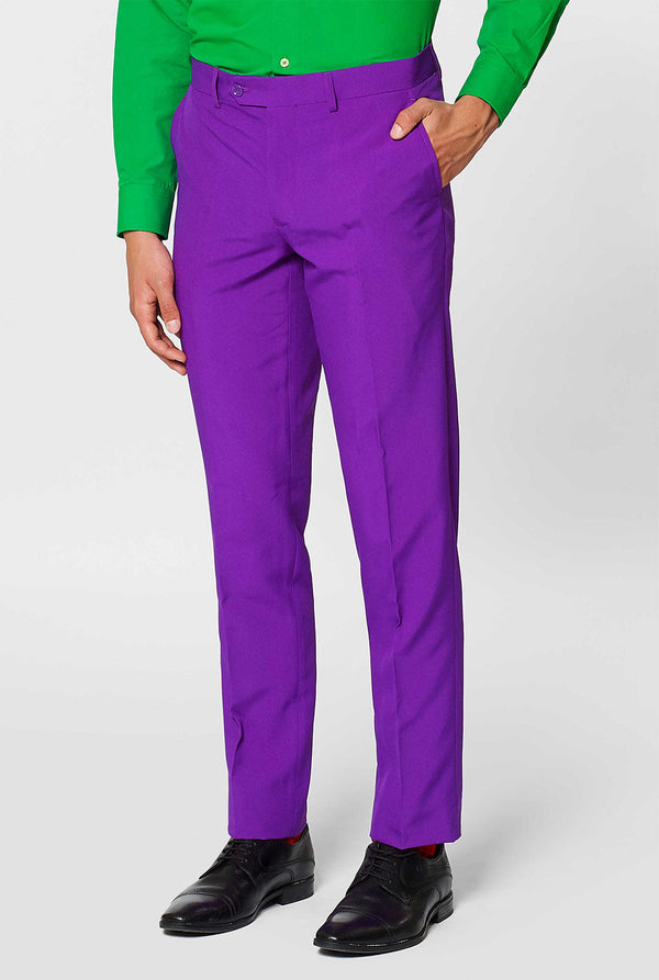 Man wearing purple men's suit and green dress shirt
