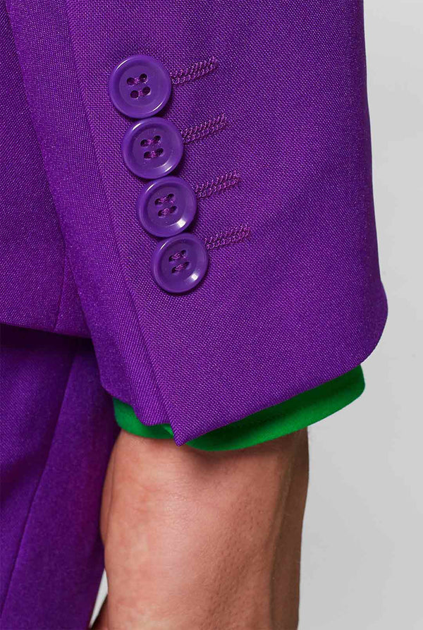 Man wearing purple men's suit and green dress shirt