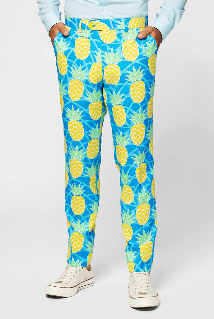 Pineapple print men's suit with bright colors by man close up