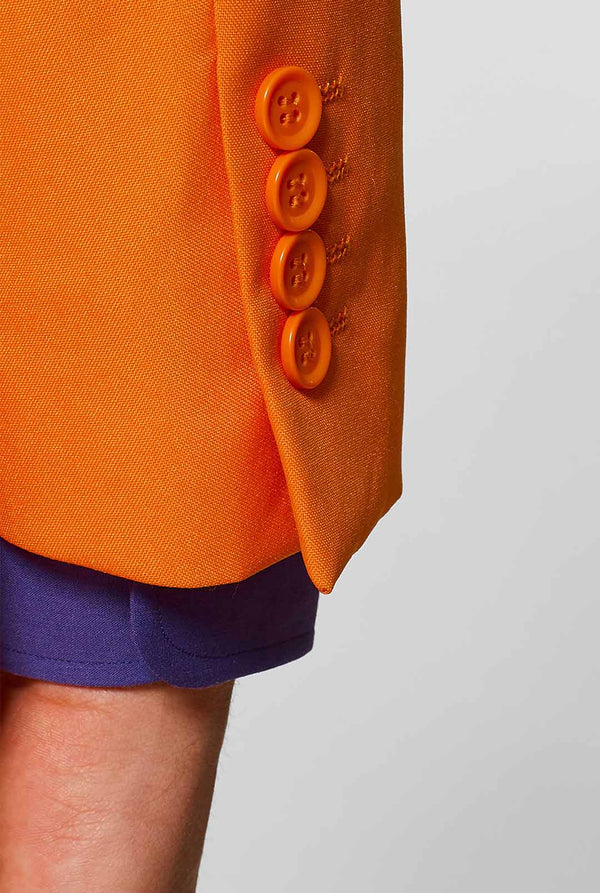 Man wearing orange men's suit with purple dress shirt