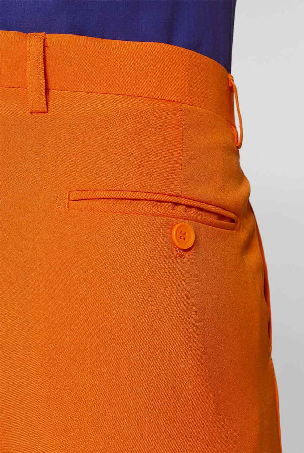 Man wearing orange men's suit with purple dress shirt