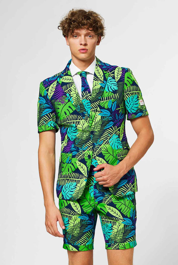 Man wearing green summer suit with jungle leaf print