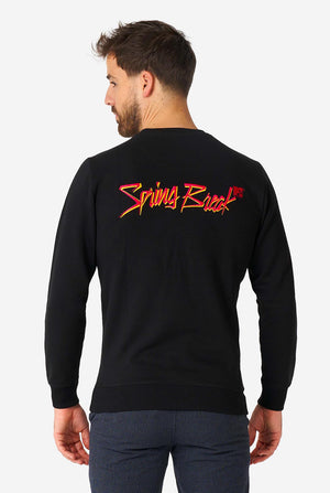 Man wearing black sweater with MTV embroidery.