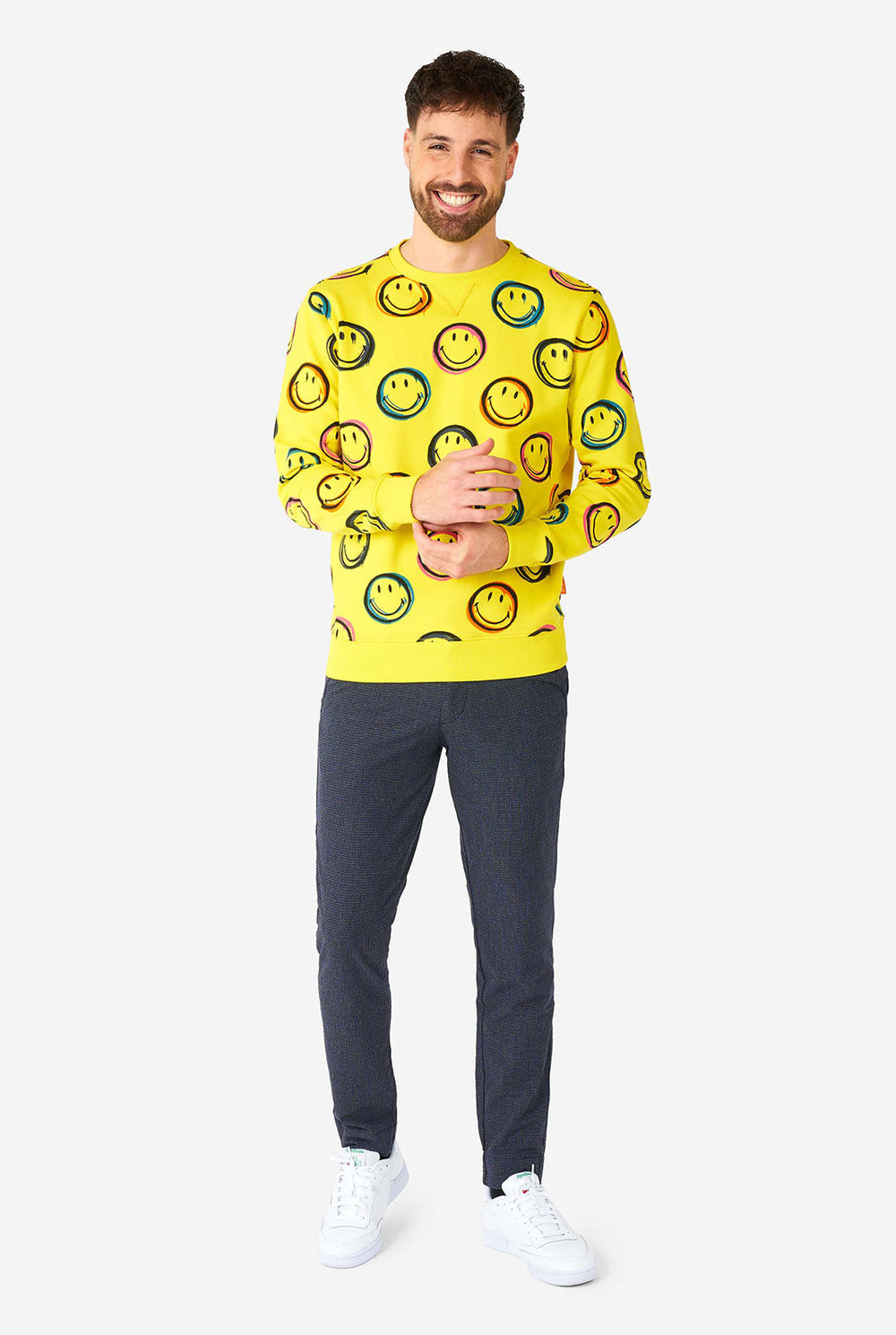 Man wearing yellow men's sweater with Smiley print