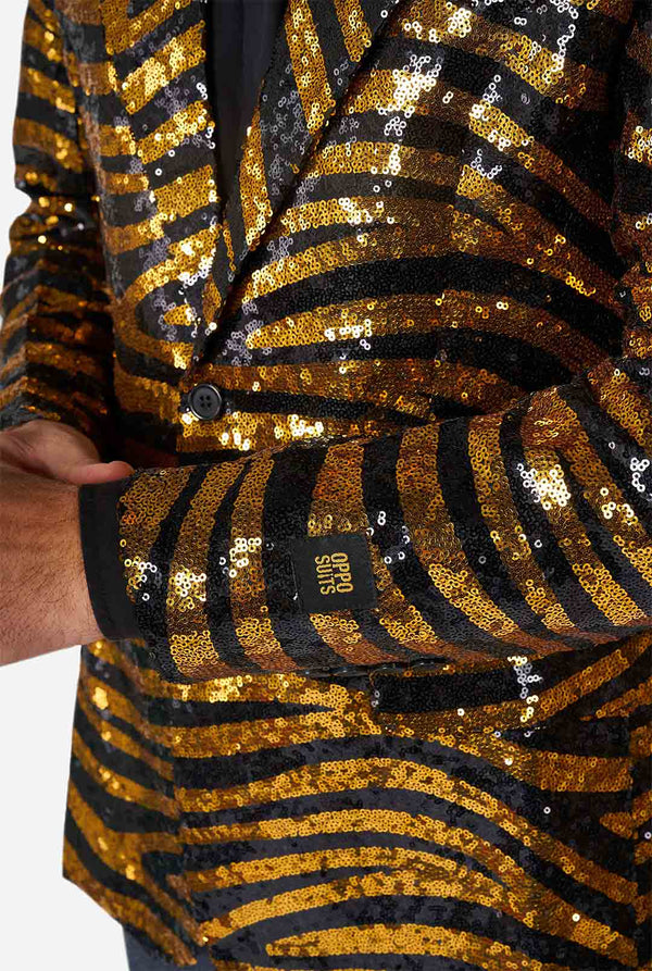 Man wearing black and gold sequins tiger stripe blazer