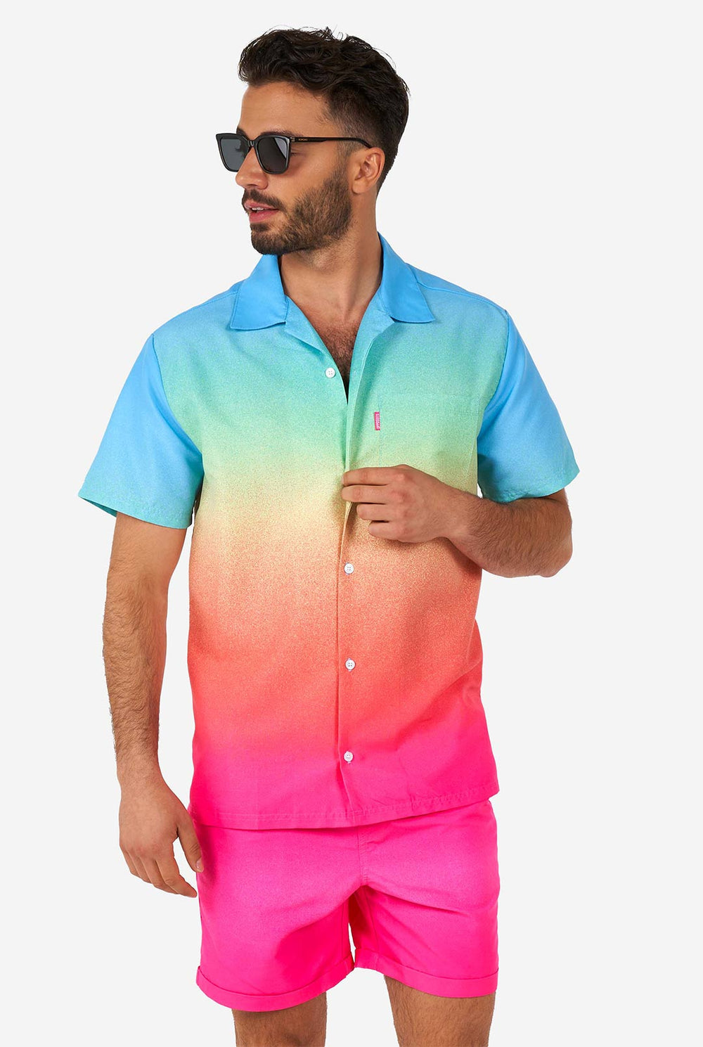 Man wearing colorful summer shorts and shirt with black sunglasses