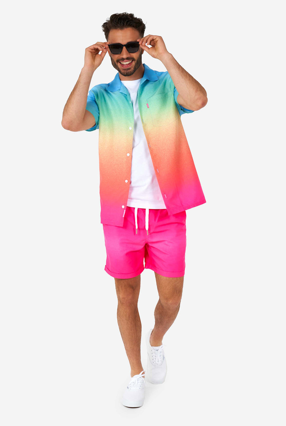 Man wearing colorful summer shorts and shirt with black sunglasses