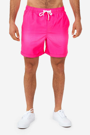 Man wearing colorful summer shorts and shirt