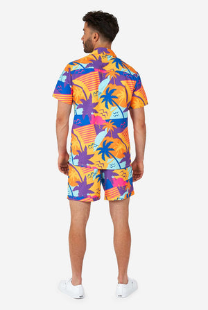 Man wearing colorful summer shorts and shirt