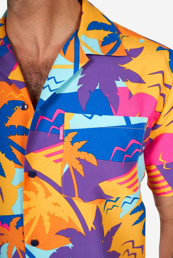 Man wearing colorful summer shorts and shirt