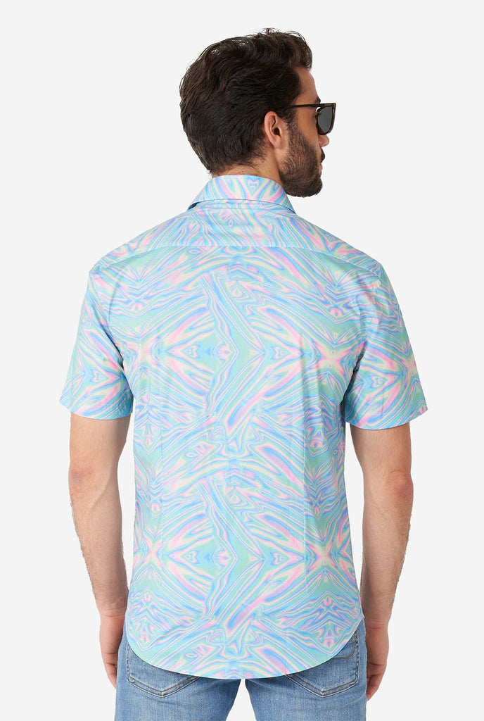 Man wearing short sleeve shirt with colorful oily print