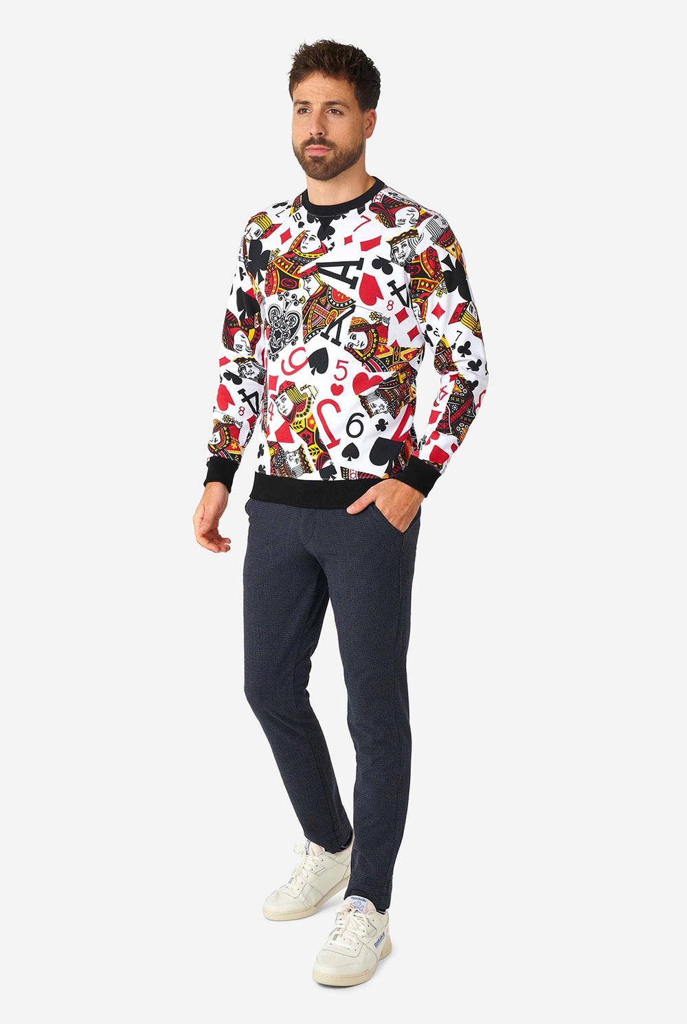 Man wearing white sweater with playing cards print