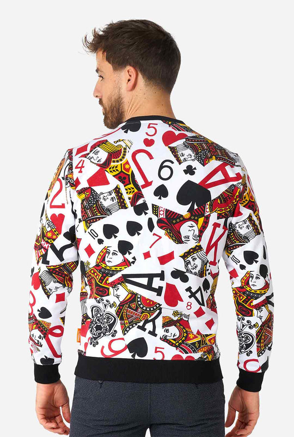 Man wearing white sweater with playing cards print