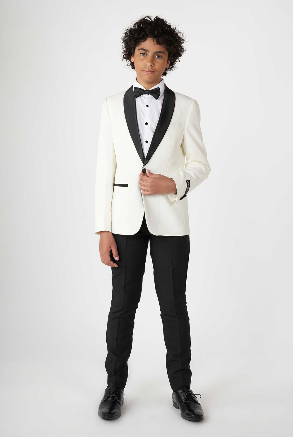 Teen wearing white and black tuxedo