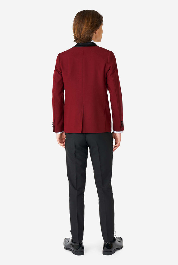 Teen wearing Burgundy red and black tuxedo, view from the back