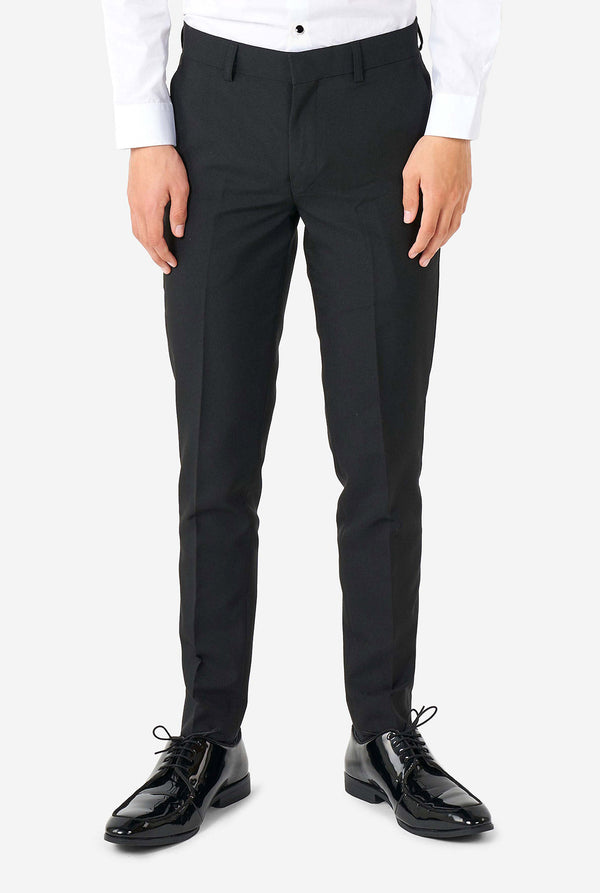 Teen wearing Burgundy red and black tuxedo, view of the pants