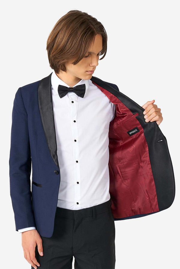 Teen wearing blue and black tuxedo