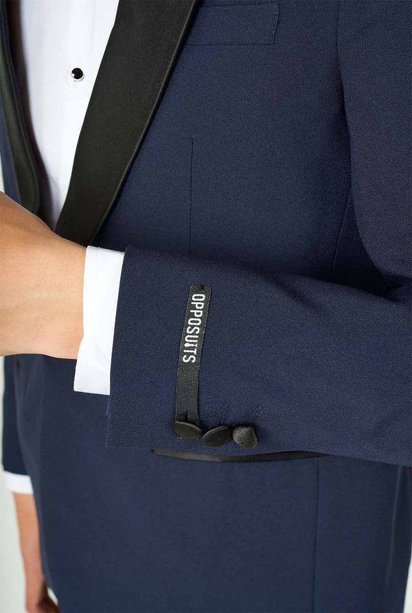 Teen wearing blue and black tuxedo